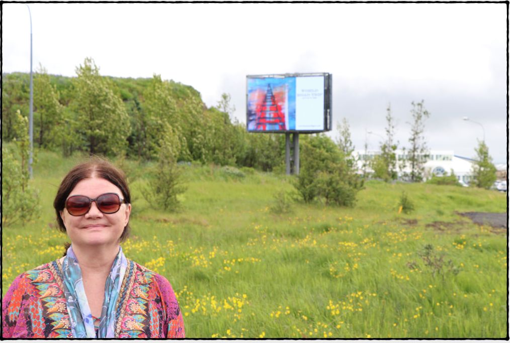 Laura Mulligan on location beside the billboard